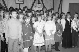 Children singing at senior citizens' Christmas dinner, Houston. (Images are provided for educational and research purposes only. Other use requires permission, please contact the Museum.) thumbnail