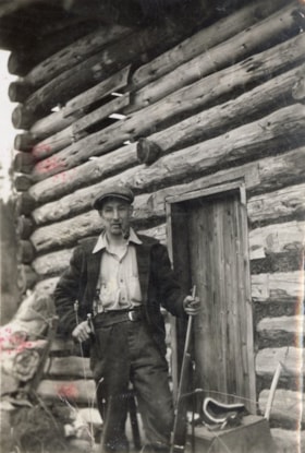 Bill Dungate outside cabin. (Images are provided for educational and research purposes only. Other use requires permission, please contact the Museum.) thumbnail