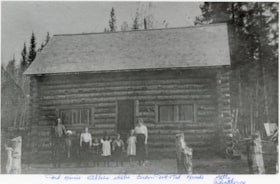Dungates and others standing in front of a log cabin. (Images are provided for educational and research purposes only. Other use requires permission, please contact the Museum.) thumbnail