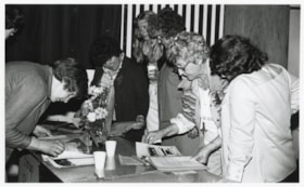 Women looking at scrapbooks; Women's Institute Conference in Houston. (Images are provided for educational and research purposes only. Other use requires permission, please contact the Museum.) thumbnail