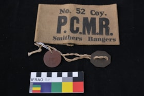 Armband and Dog tags. (Images are provided for educational and research purposes only. Other use requires permission, please contact the Museum.) thumbnail